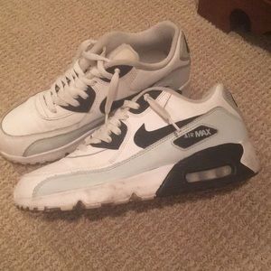 White, black, and grey Nike Air Max sneakers